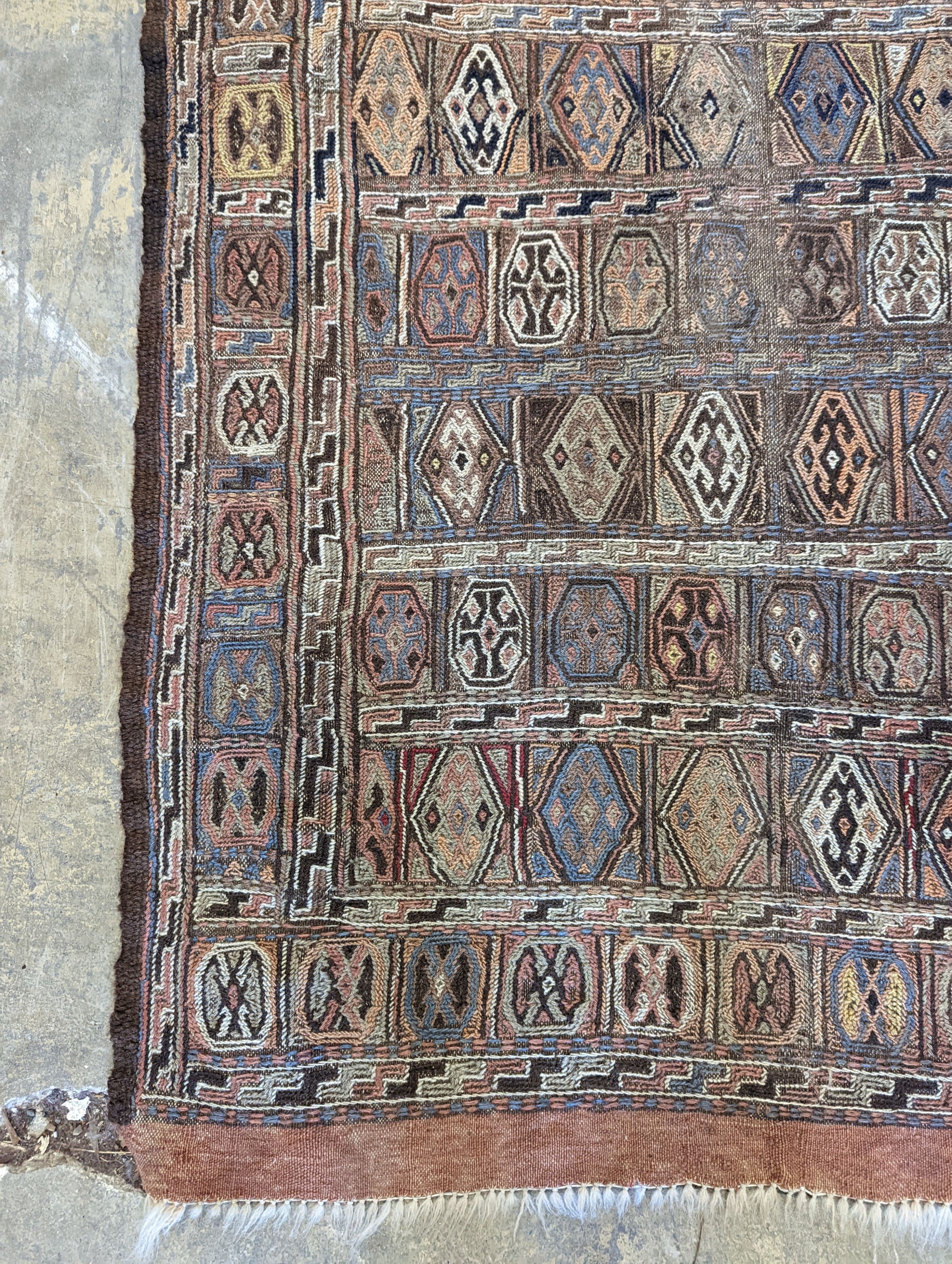 A Sumac flat weave polychrome rug, 180 x 108cm